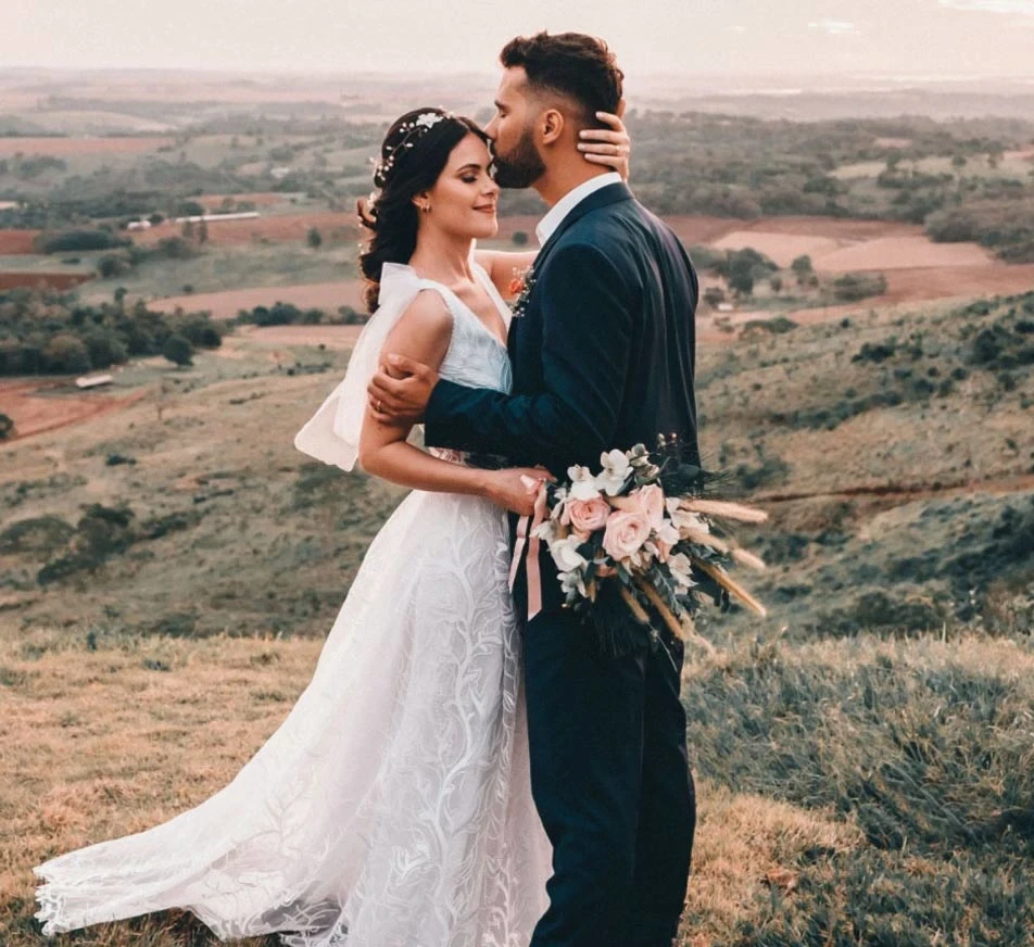 Image of a bride wearing a wedding dress and a groom in suit.